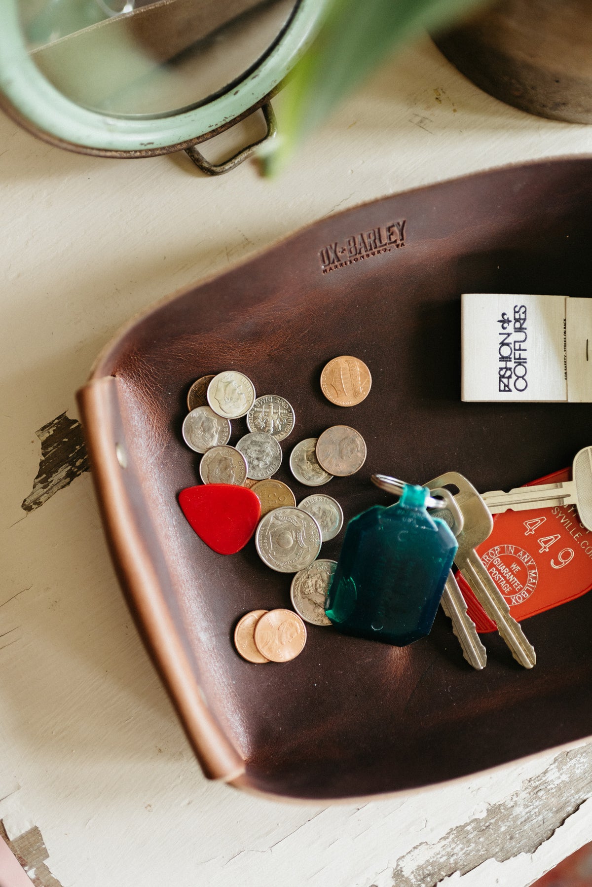 Full-grain leather butler tray holding keys, wallet and everyday carry