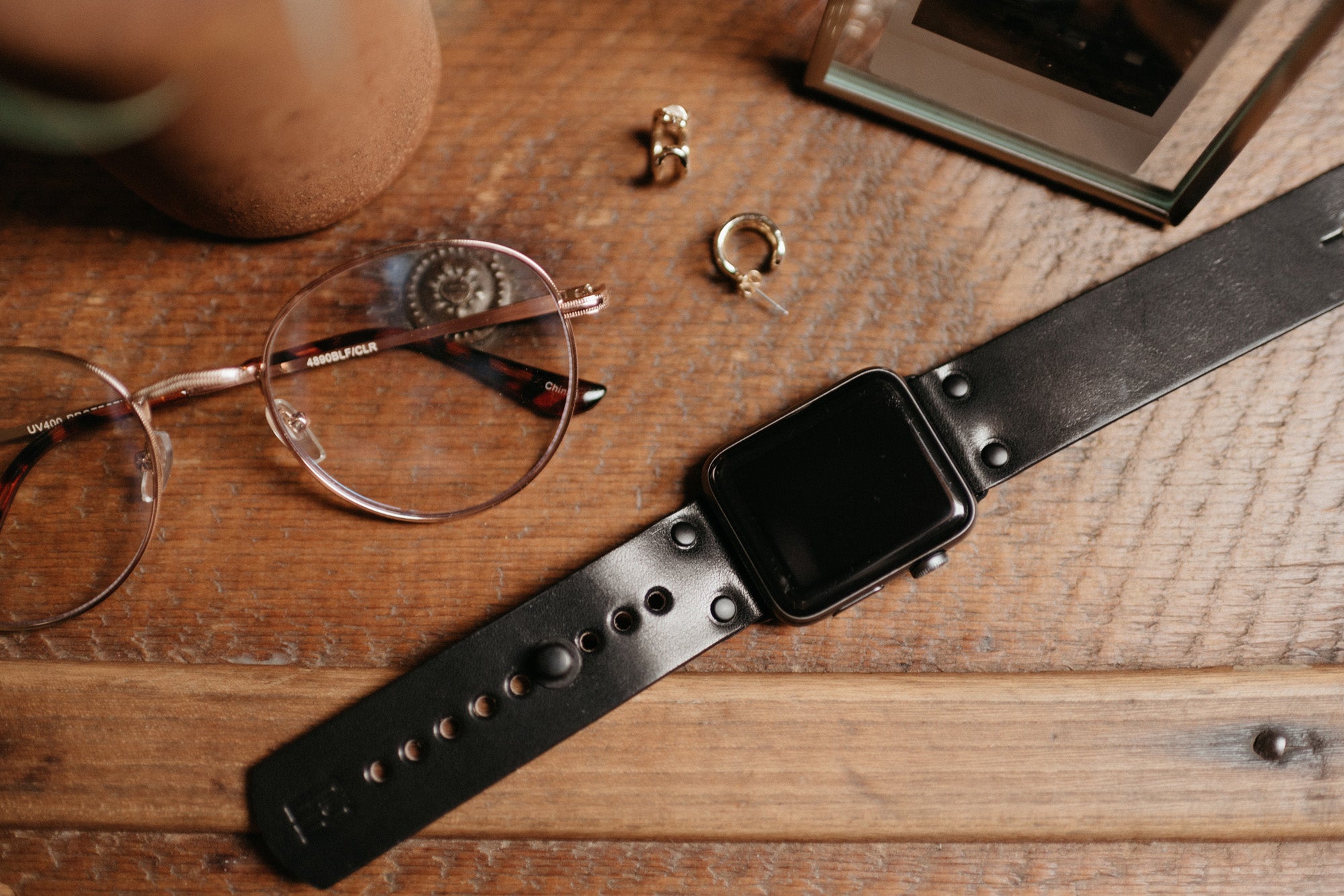 Apple Watch band in black full-grain leather with button stud closure