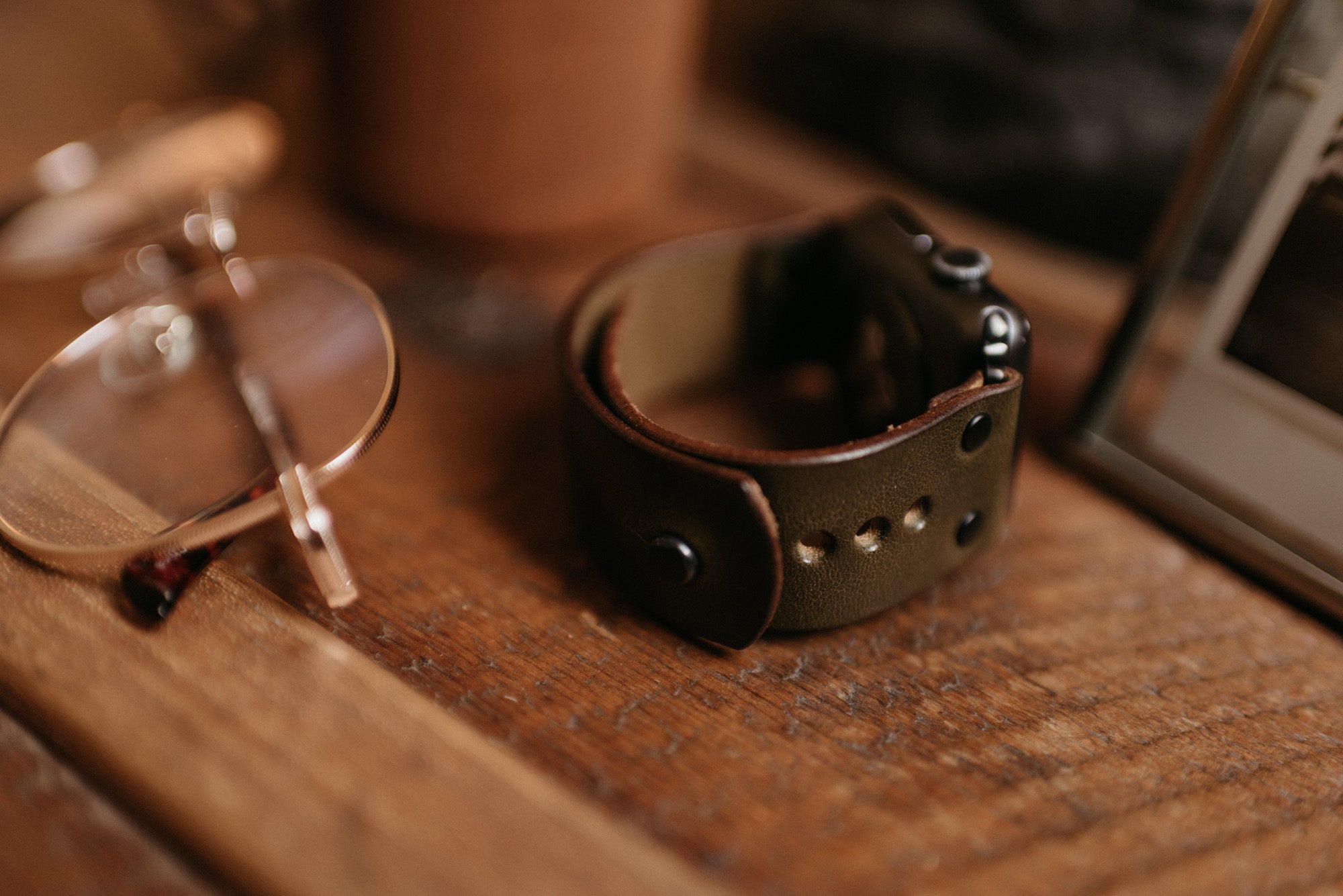 Apple Watch band in olive harness leather with button stud closure