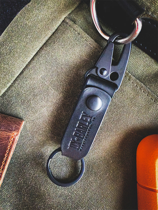 Slim black Latigo leather key fob with sling lever and belt loop snap