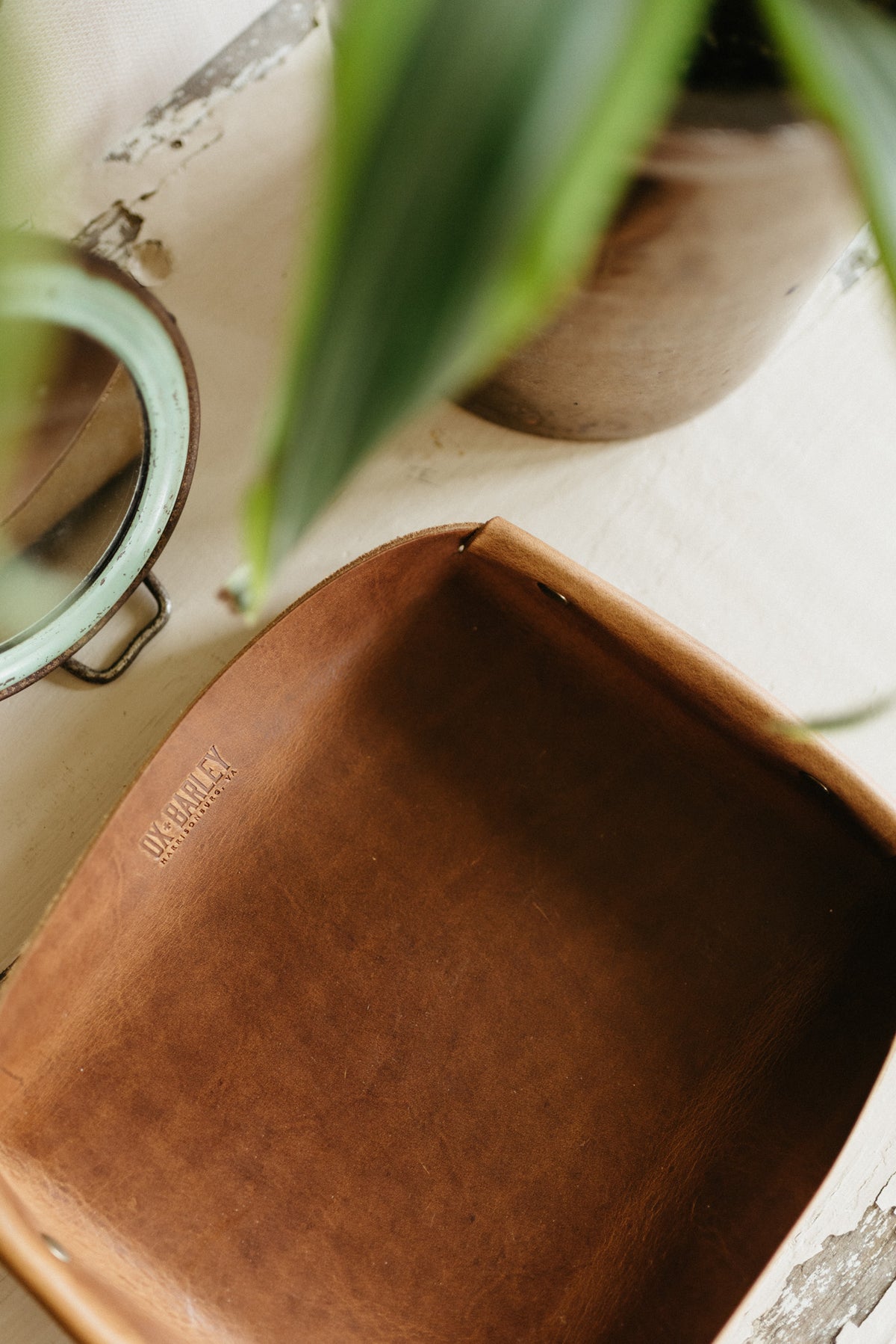 Full-grain leather butler tray holding keys, wallet and everyday carry
