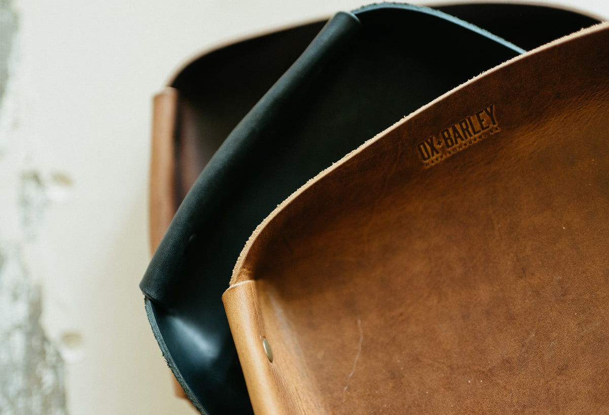 Full-grain leather butler tray holding keys, wallet and everyday carry
