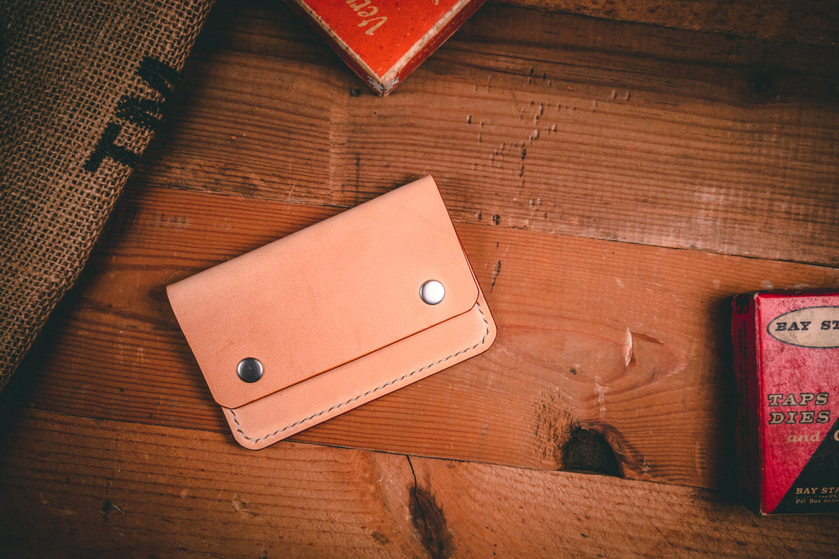 Slim card wallet in natural harness leather with solid brass snap